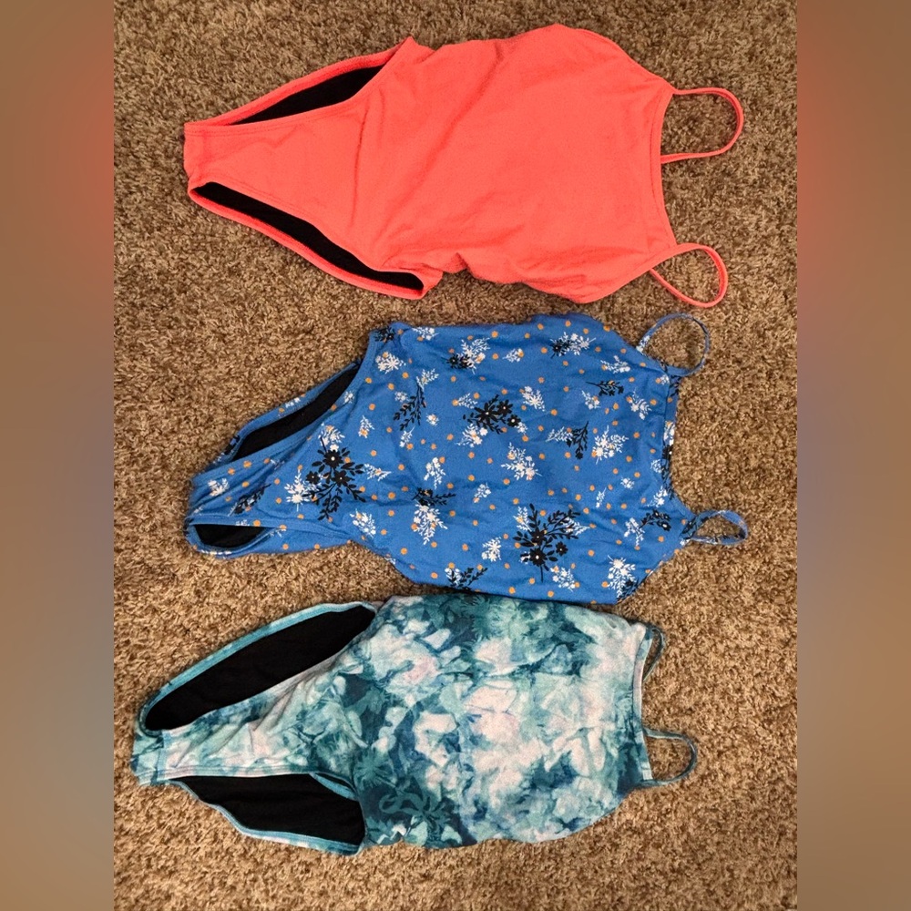 LOT OF JOLYN ONE PIECE SUITS. 3 fixed back performance suits.